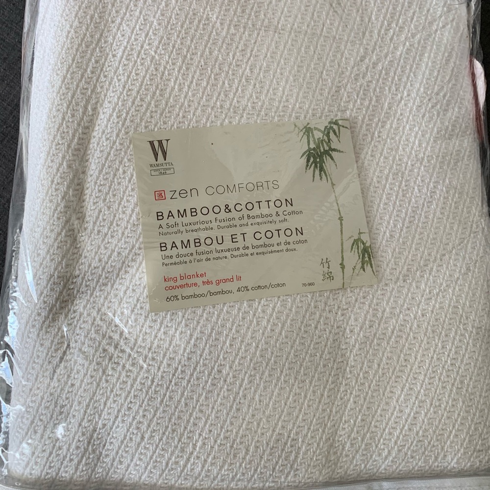 New in a bag Wamsutta white king size blanket.